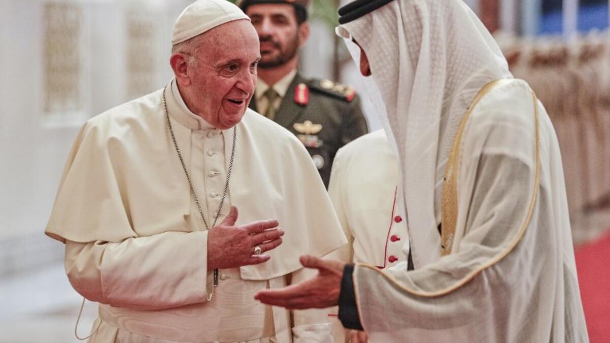 Pope Francis (L) is welcomed by Abu Dhabi's Crown Prince Sheikh Mohammed bin Zayed al-Nahyan upon his arrival at Abu Dhabi International Airport in the UAE capital on February 3, 2019. 
Andrew Medichini / POOL / AFP
