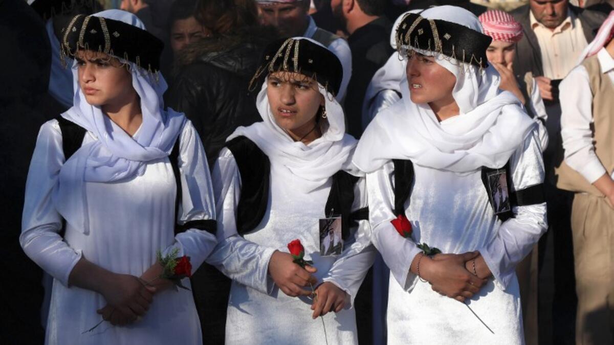 Iraqi Yazidis attend the funeral of the Mir Takhsin-Beg (Tahseen Said Ali), the hereditary leader of the Yazidi community in the world, in the town of Sheikhan, 50km northeast of Mosul.
SAFIN HAMED / AFP