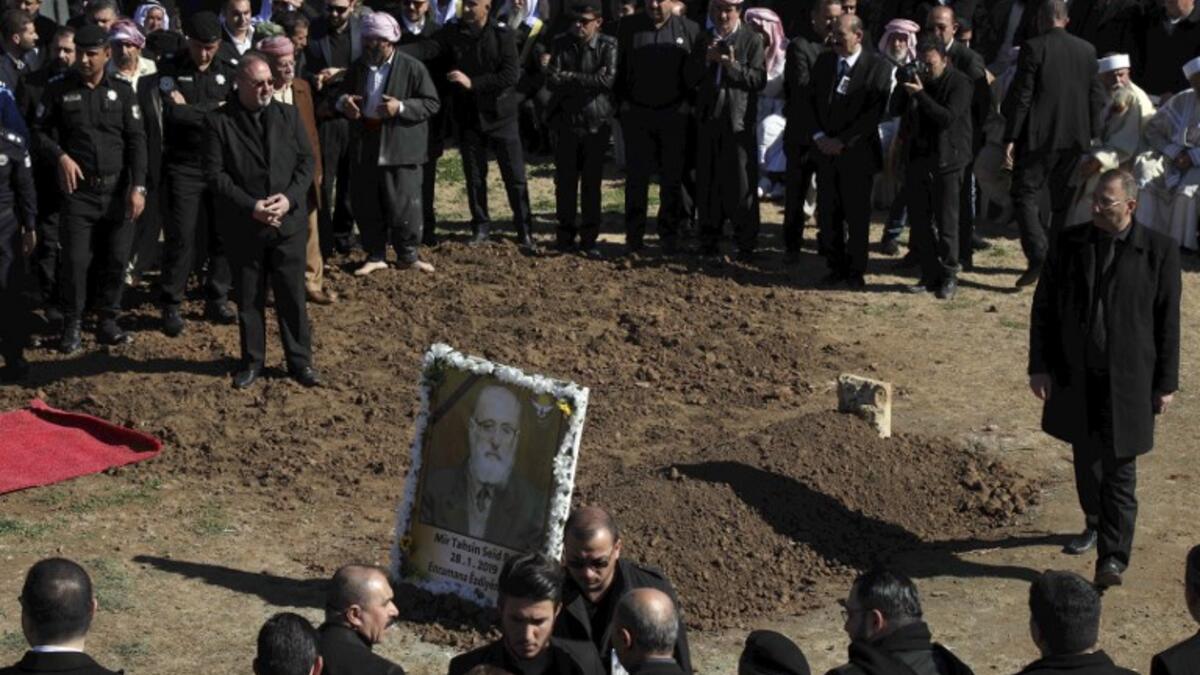 Iraqi Yazidis attend the funeral of the Mir Takhsin-Beg (Tahseen Said Ali), the hereditary leader of the Yazidi community in the world, in the town of Sheikhan, 50km northeast of Mosul.
SAFIN HAMED / AFP