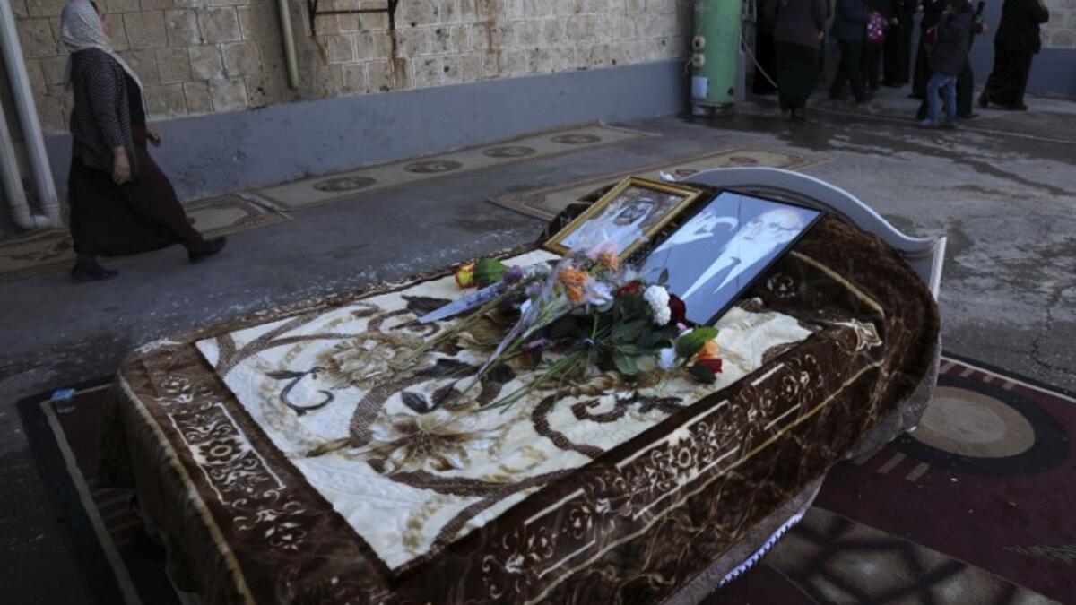 A picture taken on February 5, 2019, shows a photo of the Mir Takhsin-Beg (Tahseen Said Ali), the hereditary leader of the Yazidi community in the world, on the his bed during his funeral in the town of Sheikhan.
SAFIN HAMED / AFP