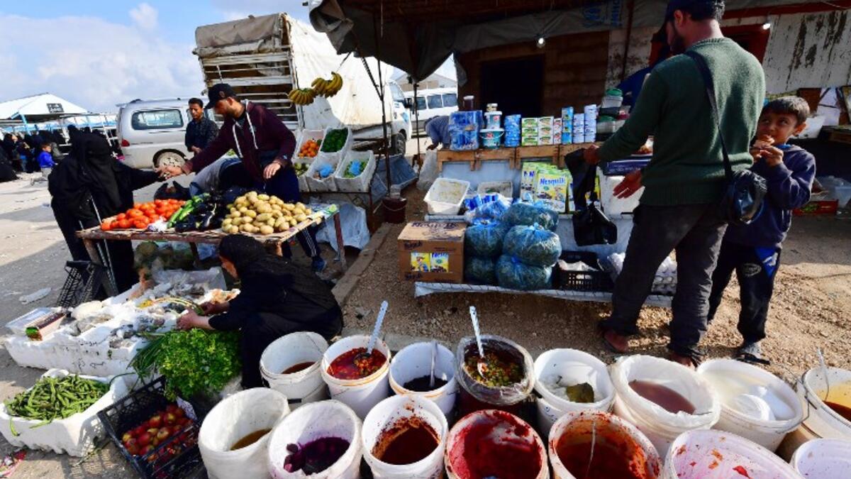 Street vendors sell pickles and vegetables in the souk or market of Al-Hol camp for displaced people in northeastern Syria
GIUSEPPE CACACE / AFP