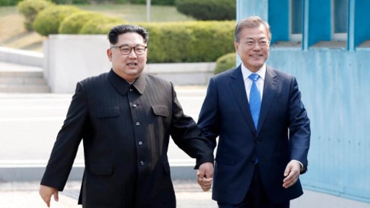 North Korea's walks from the North to the Military Demarcation Line dividing the two Koreas to meet with his South Korean counterpart. The two men stepped back over the line into the North before walking to the Peace House  for the summit -- the third of its kind since hostilities ceased in 1953. Korea Summit Press Pool/AFP