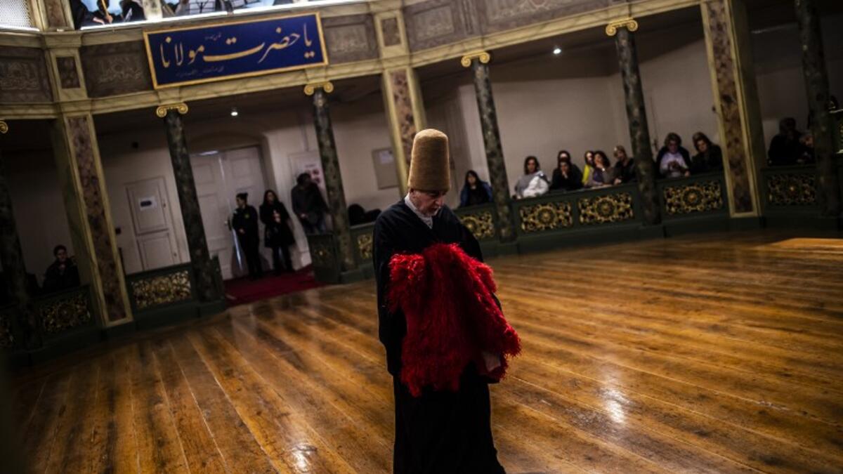 Whirling dervishes perform during a ceremony marking the anniversary of the death of Jelaleddin Mevlana Rumi, Sufi mystic, poet and founder of the sufism on December 16, 2018 at Galata Mevlihanesi in Istanbul.  
Yasin AKGUL / AFP