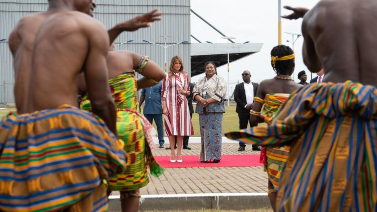 US First Lady Melania Trump (C-L) and Rebecca Akufo-Addo, the First Lady of Ghana, watch traditional dancers during an arrival ceremony after landing at Kotoka International Airport in Accra October 2, 2018. (SAUL LOEB / AFP)