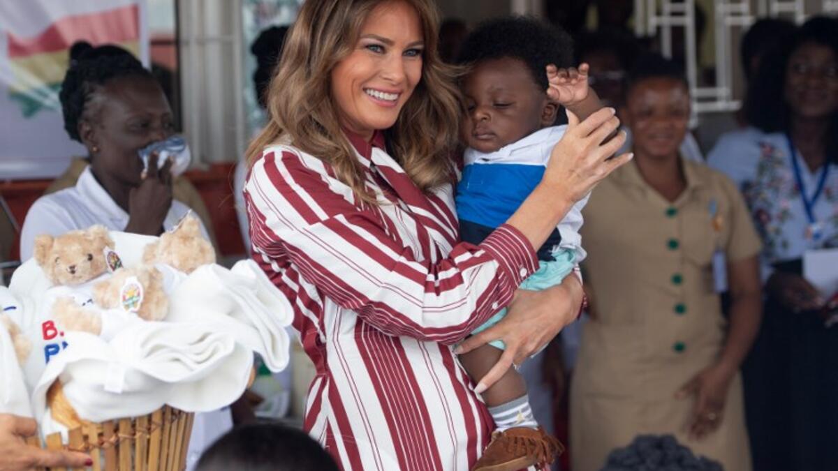 US First Lady Melania Trump holds a baby during a visit to the Greater Accra Regional Hospital in Accra, on October 2, 2018. (SAUL LOEB / AFP)
