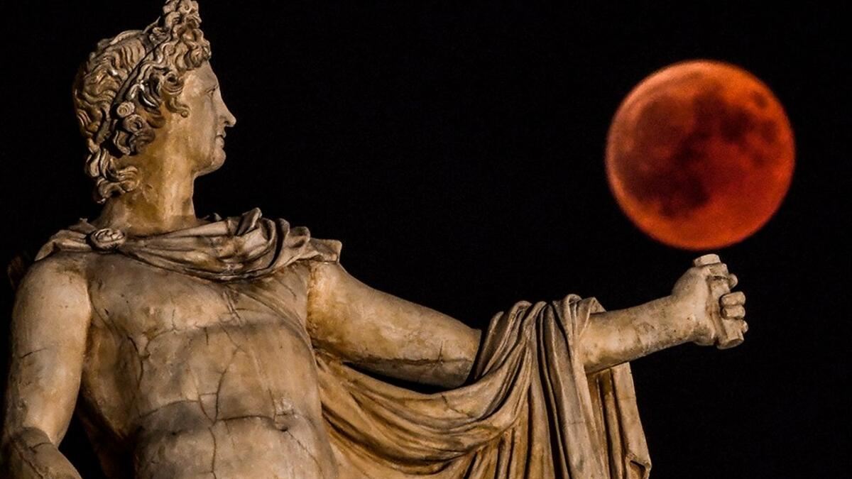 Ancient gods and goddesses appear to play with the ‘Blood Moon’ in Athens (Twitter, AFP)