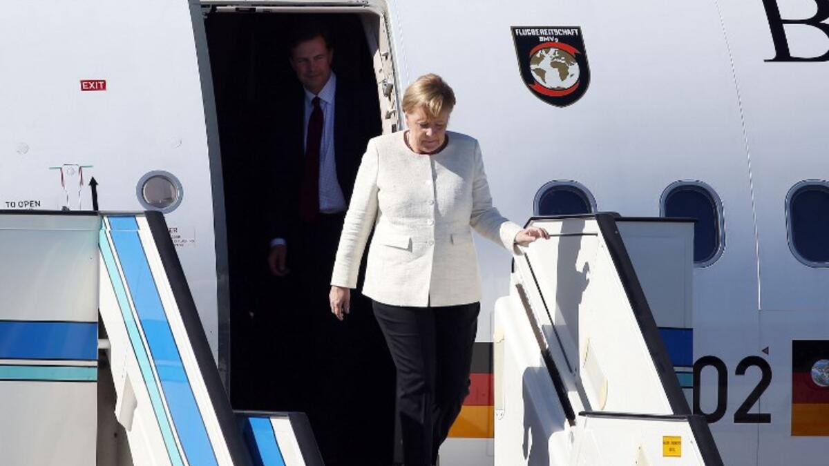 German Chancellor Angela Merkel arrives at Atatürk International Airport in Istanbul on October 27, 2018, to take part in the ''Four-way Istanbul summit on Syria''. (ISLAM YAKUT / POOL / AFP)