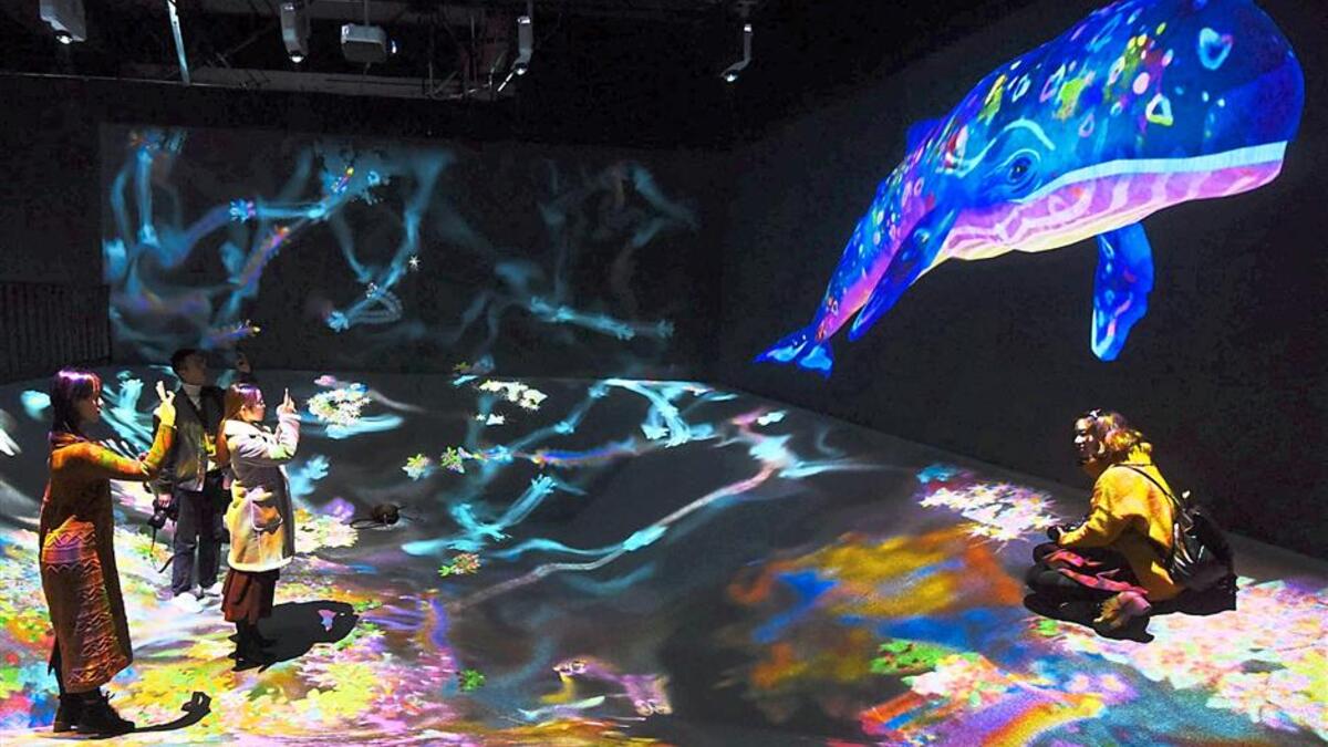 Visitors taking snapshots at the ‘teamLab: Dance Art Exhibition, Learn And Play Future Park’ held in Hangzhou in China’s eastern Zhejiang province late last year. (AFP/ File)