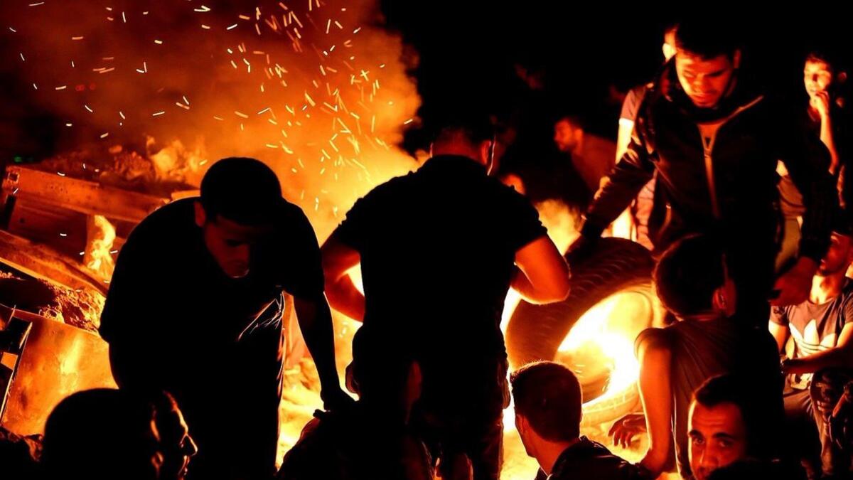 A Palestinian protesters from a group calling themselves the "night confusion units"  (Twitter/Fadi Thabet)