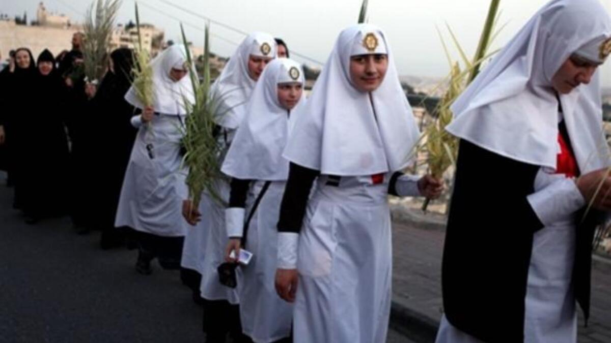 Jerusalem the week before His crucifixion, when a cheering crowd greeted Him waving palm leaves.