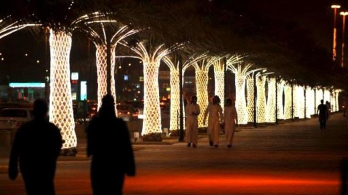 Saudi nights filled with lights: Saudis walk on King Abdullah Street decorated with lights ahead of celebrations for Eid al-Fitr. Lights mark the whole season of Ramadan and are aglow during Eid especially, sometimes complementing firework displays.