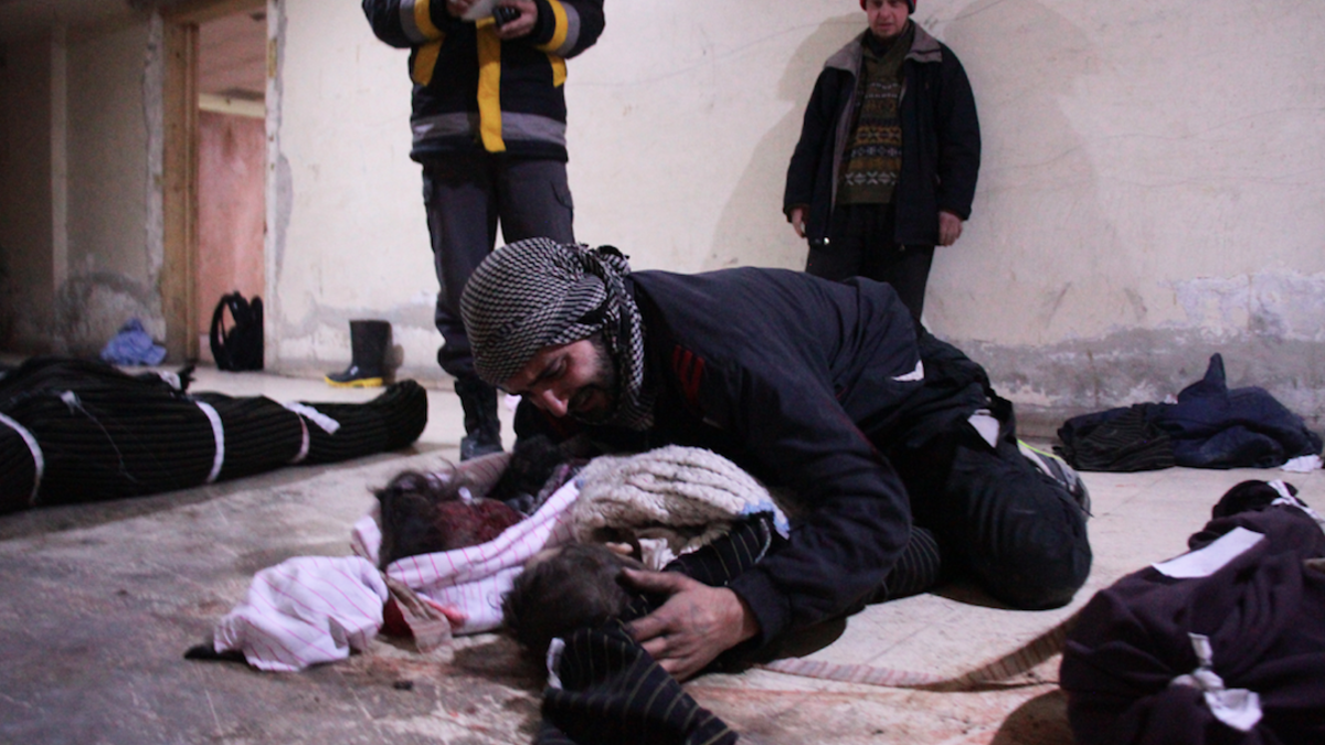 Parents in Syria's Ghouta search for children both dead and alive. /AFP Hamza Al-Ajweh