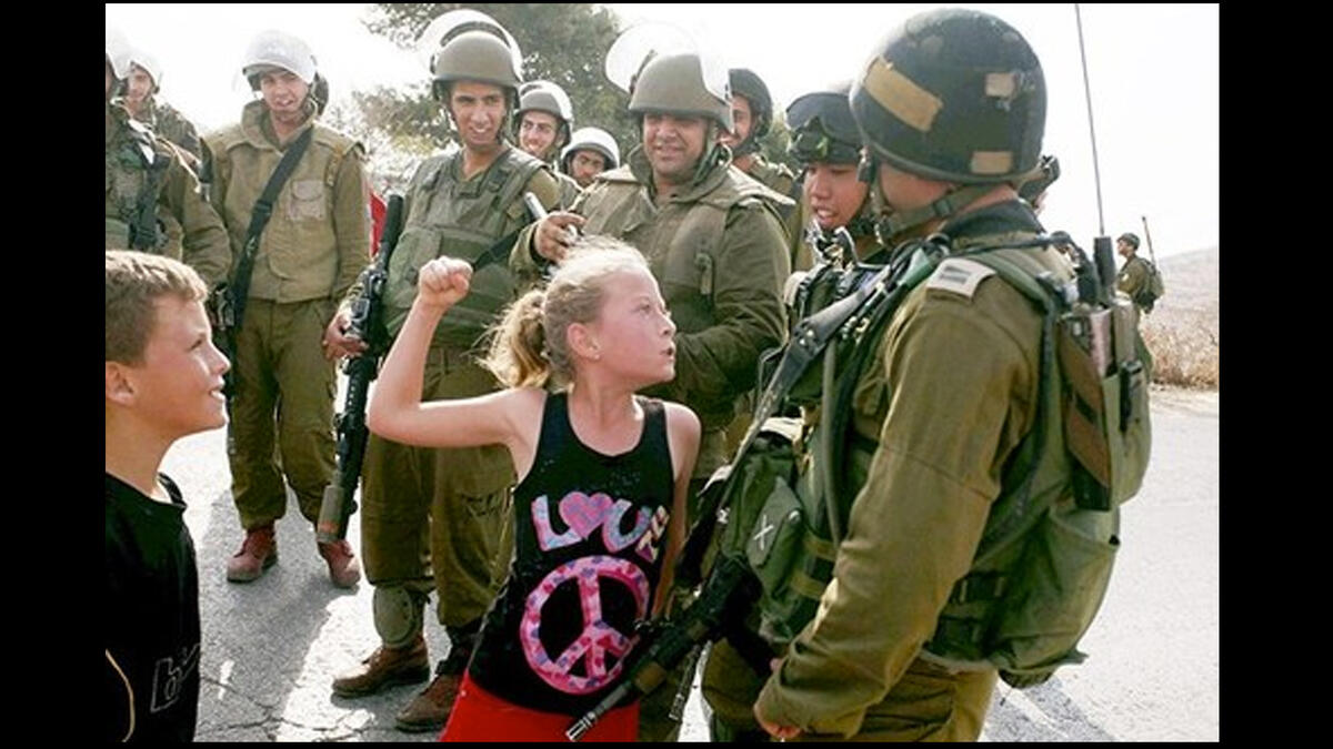 ahed tamimi shaking fist israeli soldier