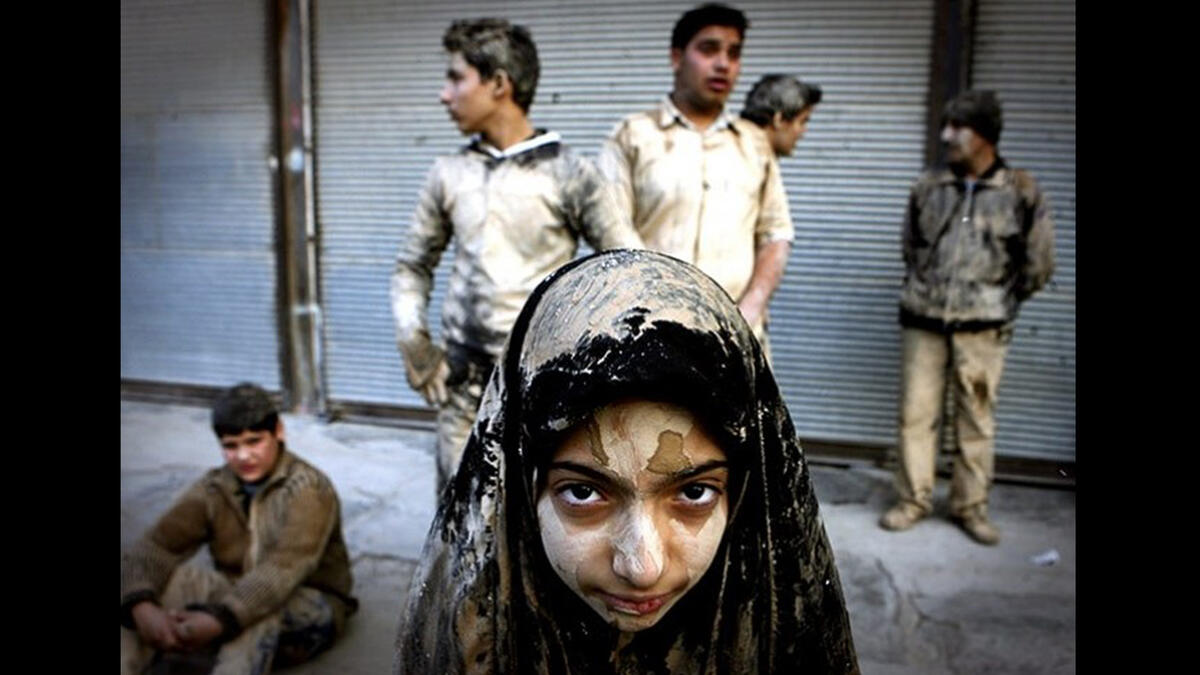 Maarouf's studies found that Ashura carnivals are mainly performed by rural females who belong to uneducated, poor, urban societies. Educated women from modern-middle-class urban families typically do not  participate in the holy day's ritual parades, chanting or covering their clothes and faces in mud.