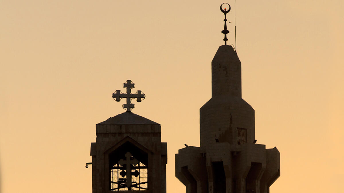 church next to mosque silhouette