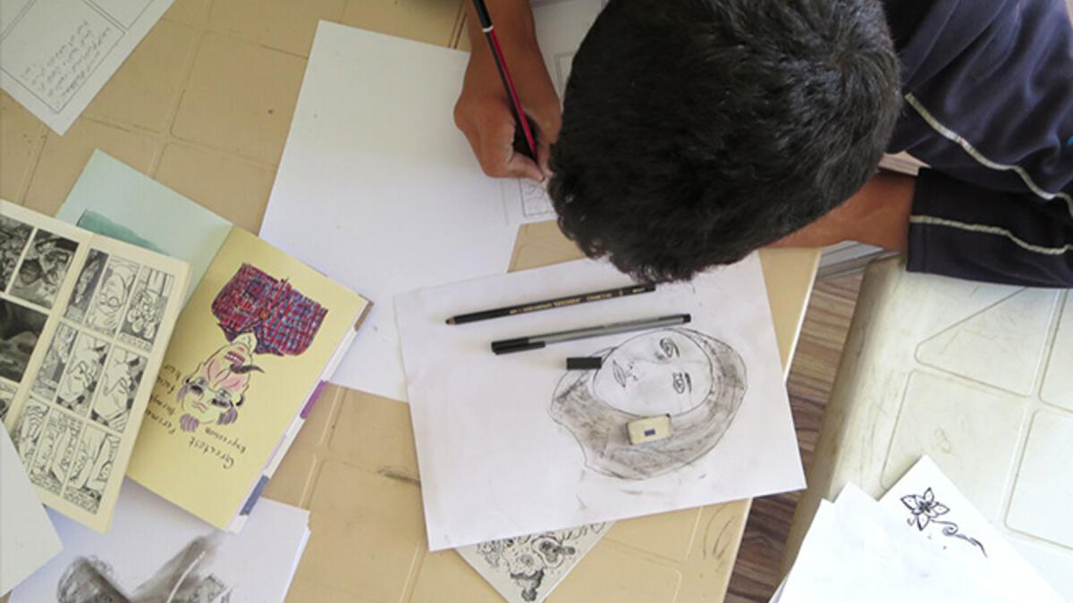 Cultural context required some special attention, as the men were uncomfortable drawing women who are not family members. IRD staffer Mays stepped in as life model and the guys practiced sketching her expressions and the folds of her hijab. Bradbury told them, "You leave out half your stories if you can't draw life-like women."