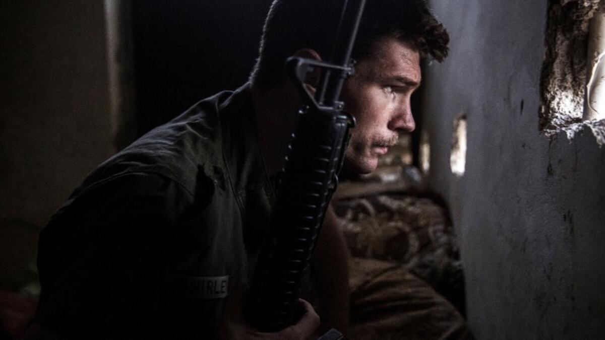 A 23-year old fighter and ex-US marine from the US, nicknamed ‘Hewal Agir,’ guards a look out point during clashes with Daesh fighters in the outskirts of Tal Tamr on April 17, 2015.
