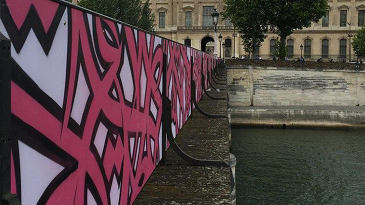 Paris bridge love locks art graffiti