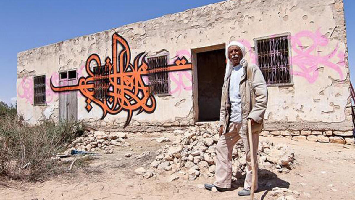 eL Seed graffiti wall Arab artist Temoula