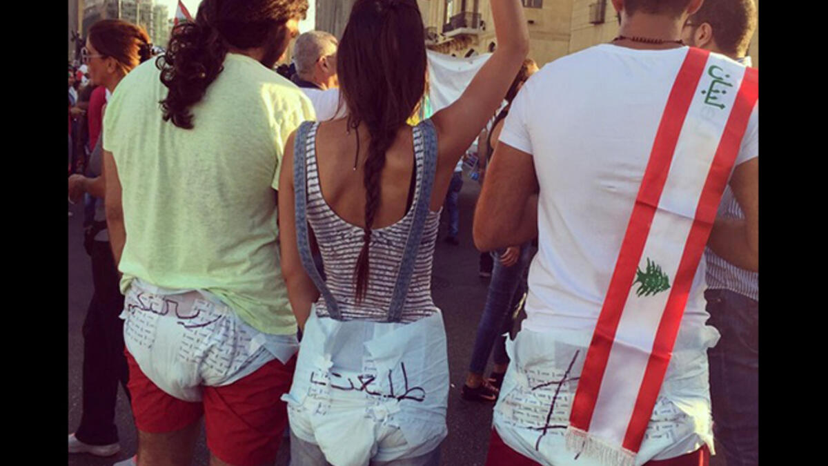 Beirut protesters dressed in baby nappies