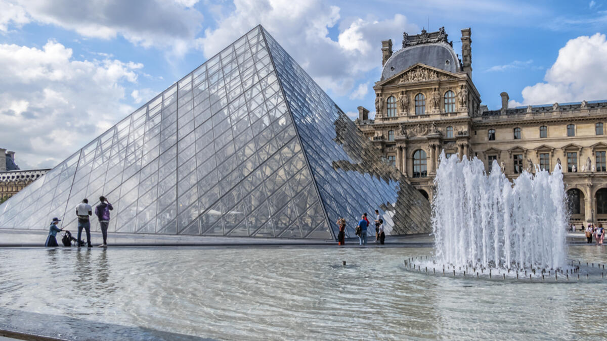 View of pyramid and fountain at main courtyard (Cour Napoleon) of Louvre Museum. (Shutterstock/ File)