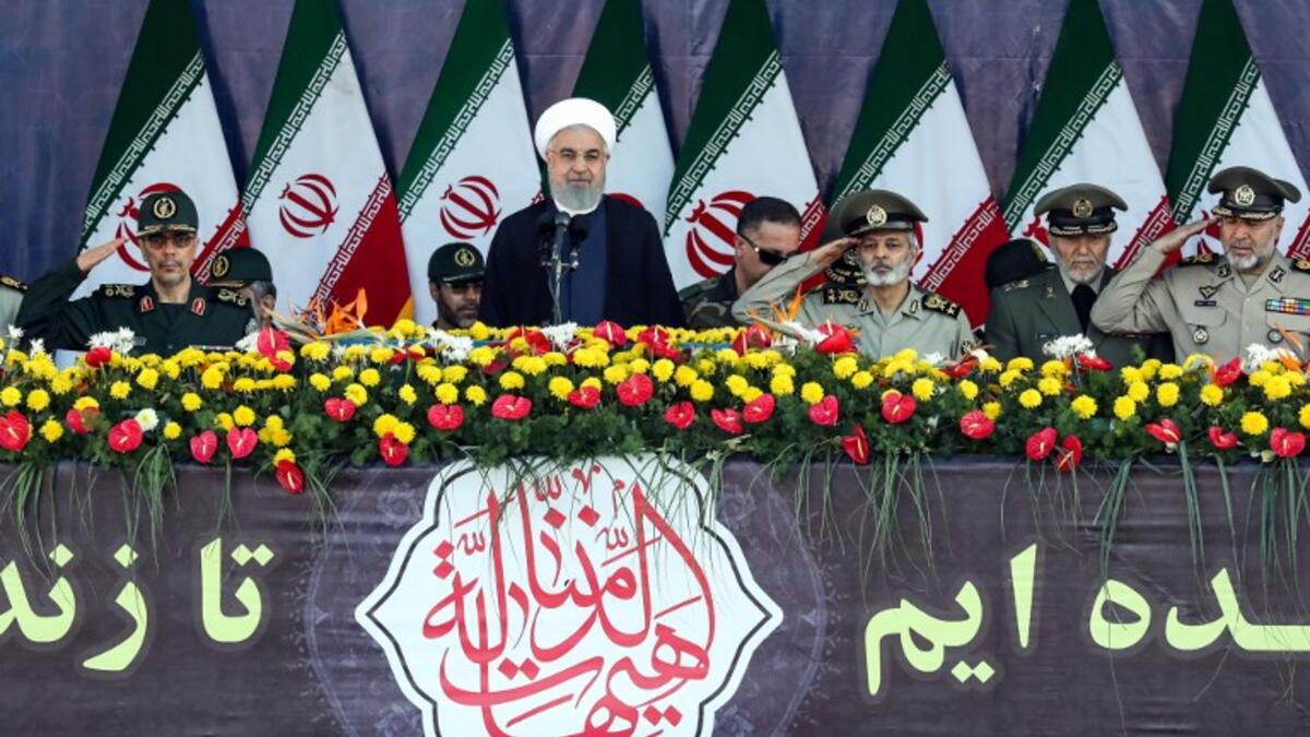 Iranian President Hassan Rouhani delivers a speech during the annual military parade marking the anniversary of the outbreak of the devastating 1980-1988 war with Saddam Hussein's Iraq, in the capital Tehran on September 22, 2018. (STRINGER / AFP)