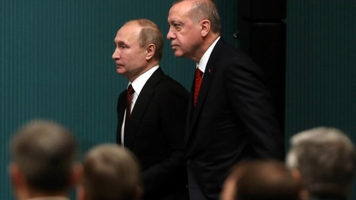 Russian President Vladimir Putin (L) and Turkish President Recep Tayyip Erdogan (R) arrive for a joint press conference on April 3, 2018.  Putin launched the construction of Turkey's first nuclear power station and quicken the delivery of air defence systems to Ankara that has alarmed NATO. (ADEM ALTAN / AFP)