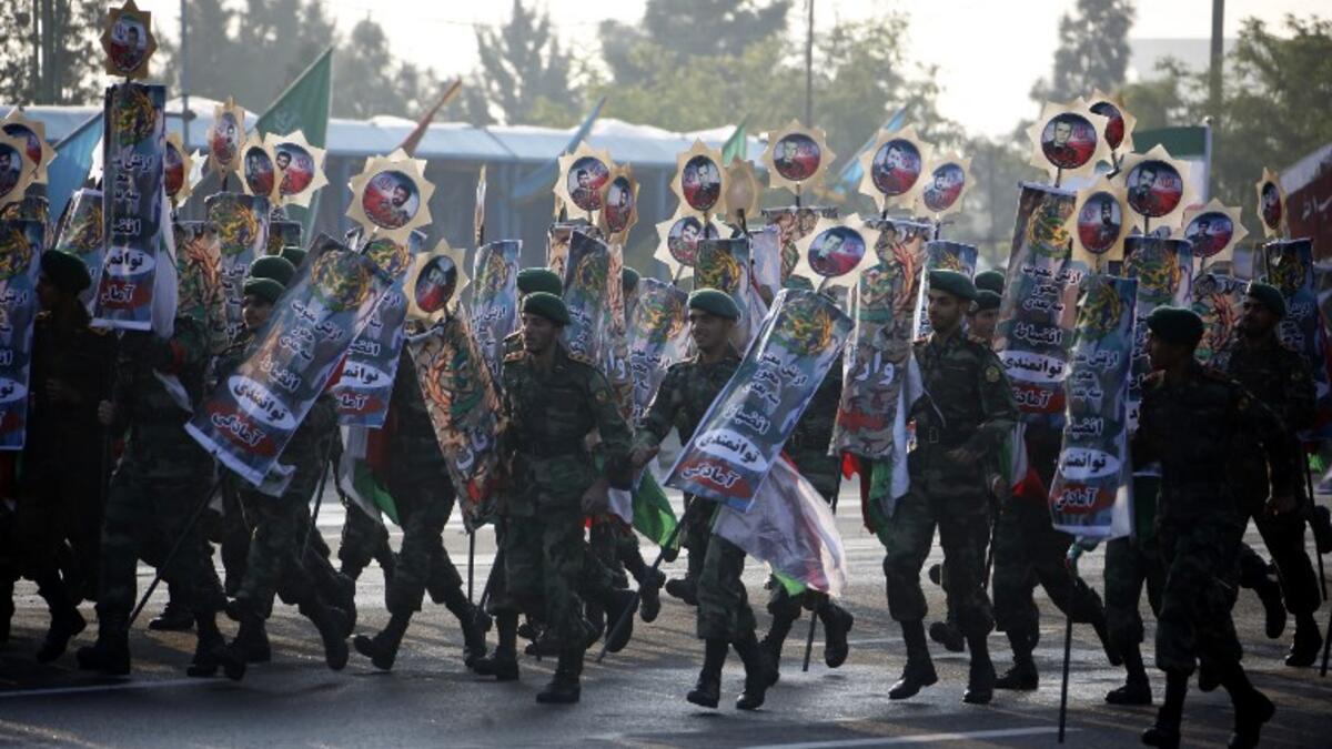 Iranian soldiers play during a parade on the occasion of the country's annual Army Day on April 18, 2018 in Tehran. ATTA KENARE / AFP
