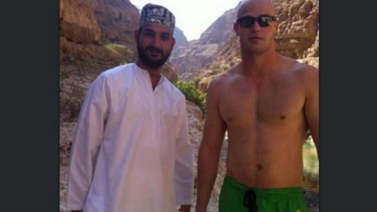 foreign man looking sexy next to an Arab local