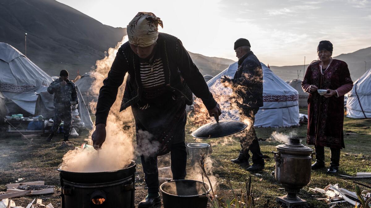 Preparing breakfast at the yurt encampment, inhabited by seasonal nomads (nytimes.com)