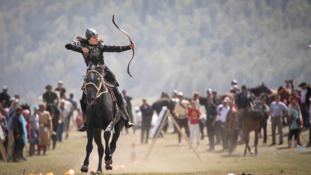 Woman competing in archery on horseback game (Shutterstock/File Photo)