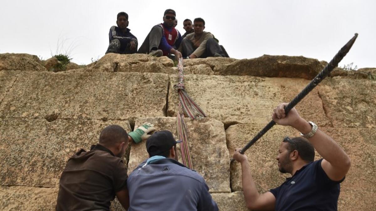 Experts and students from Algiers University’s Archaeology Institute work on one of the Jeddars pyramid tombs, near the city of Tiaret.
RYAD KRAMDI / AFP