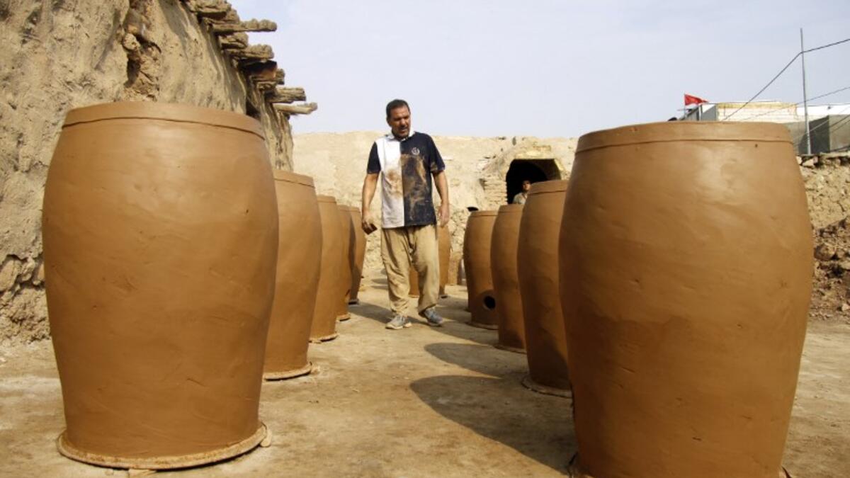 Iraqis making clay pots in Najaf on November 11, 2018. Pottery has deep roots in Iraq, where ancient civilisations turned to clay to build their homes, shape their cooking utensils, and even make their ovens.
Haidar HAMDANI / AFP