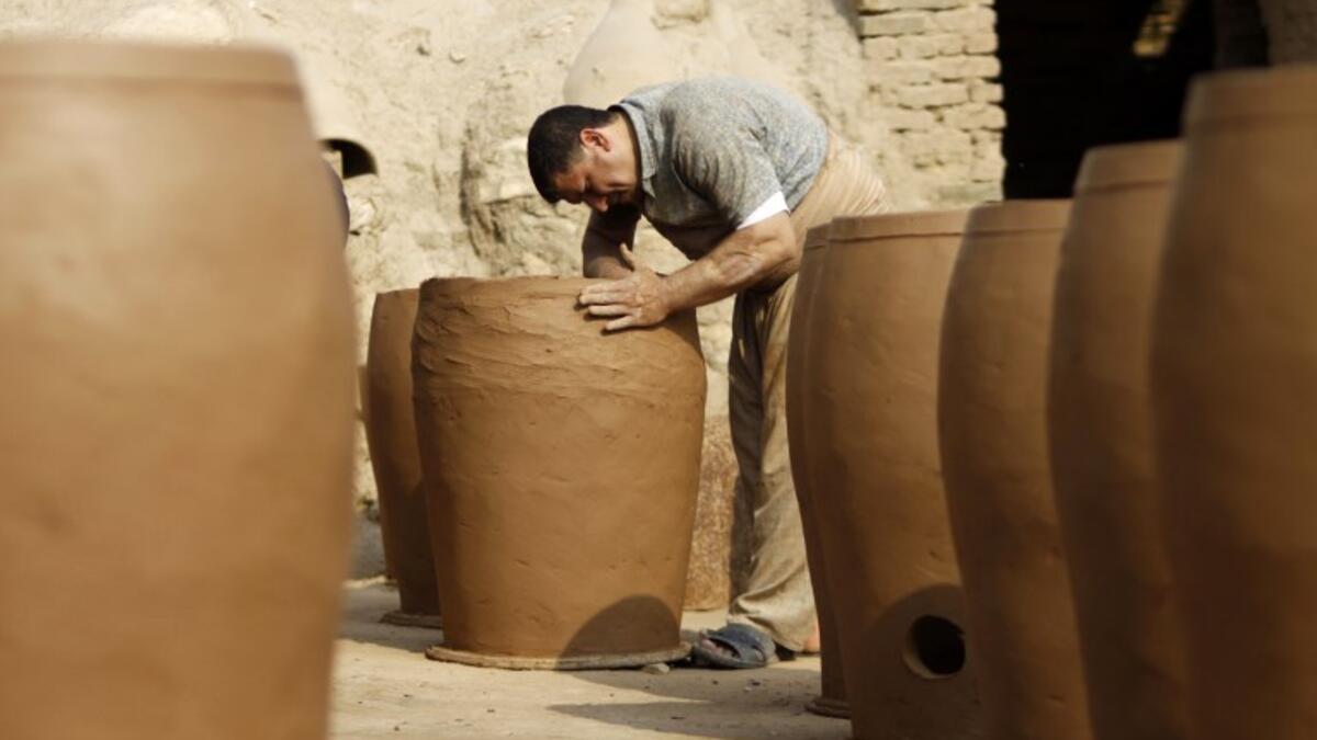 Iraqis making clay pots in Najaf on November 11, 2018. Pottery has deep roots in Iraq, where ancient civilisations turned to clay to build their homes, shape their cooking utensils, and even make their ovens.
Haidar HAMDANI / AFP