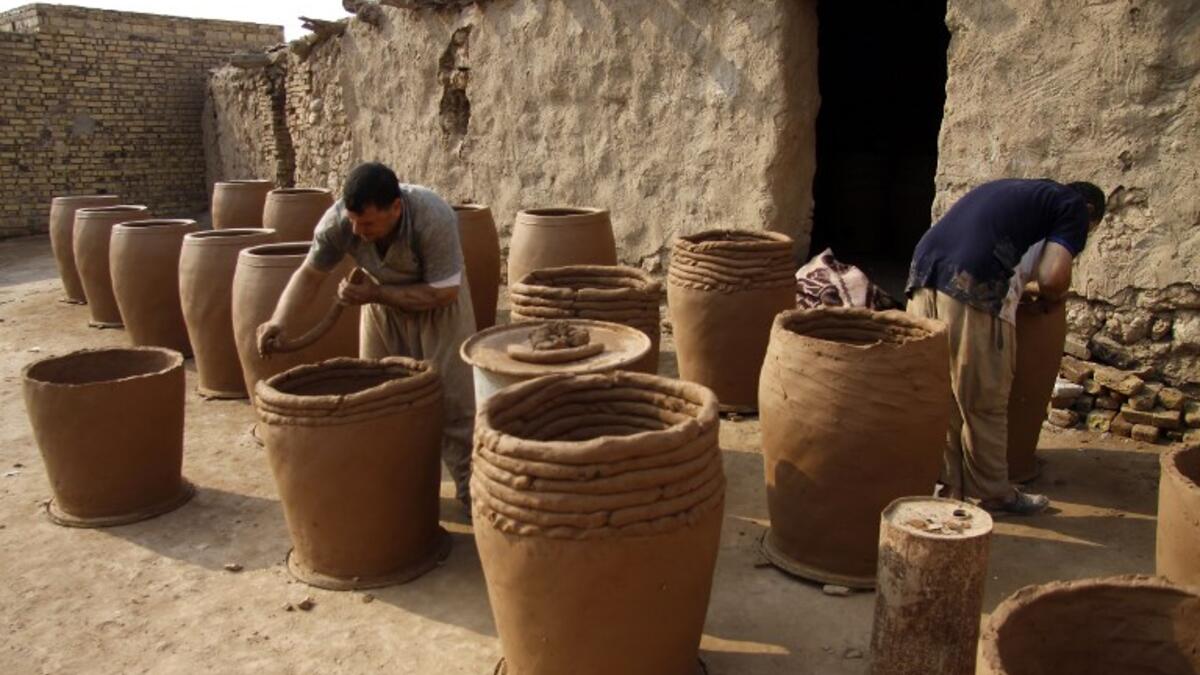 Iraqis making clay pots in Najaf on November 11, 2018. Pottery has deep roots in Iraq, where ancient civilisations turned to clay to build their homes, shape their cooking utensils, and even make their ovens.
Haidar HAMDANI / AFP