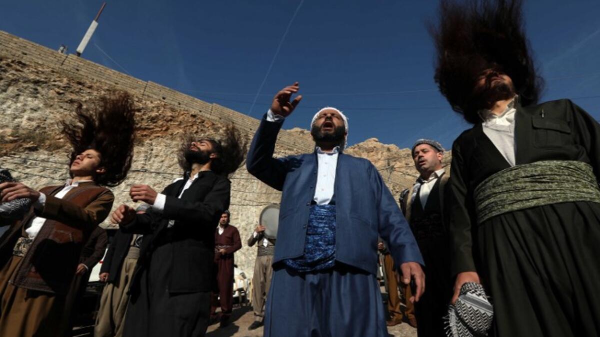 Iraqi Sufi Muslim Kurds take part in a ritual ceremony to commemorate the birth of the Prophet Mohammed in the Kurdish town of Akra, 500 km north of Baghdad, on November 19, 2018.
SAFIN HAMED / AFP