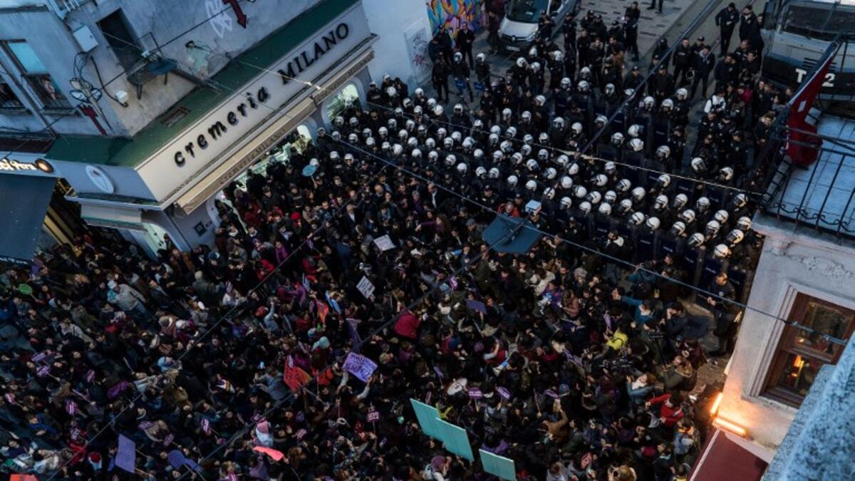 Women's rights activists gather to march through Taksim Square to protest against gender violence in Istanbul, on November 25, 2018, on the International Day for the Elimination of Violence against Women. 
Yasin AKGUL / AFP