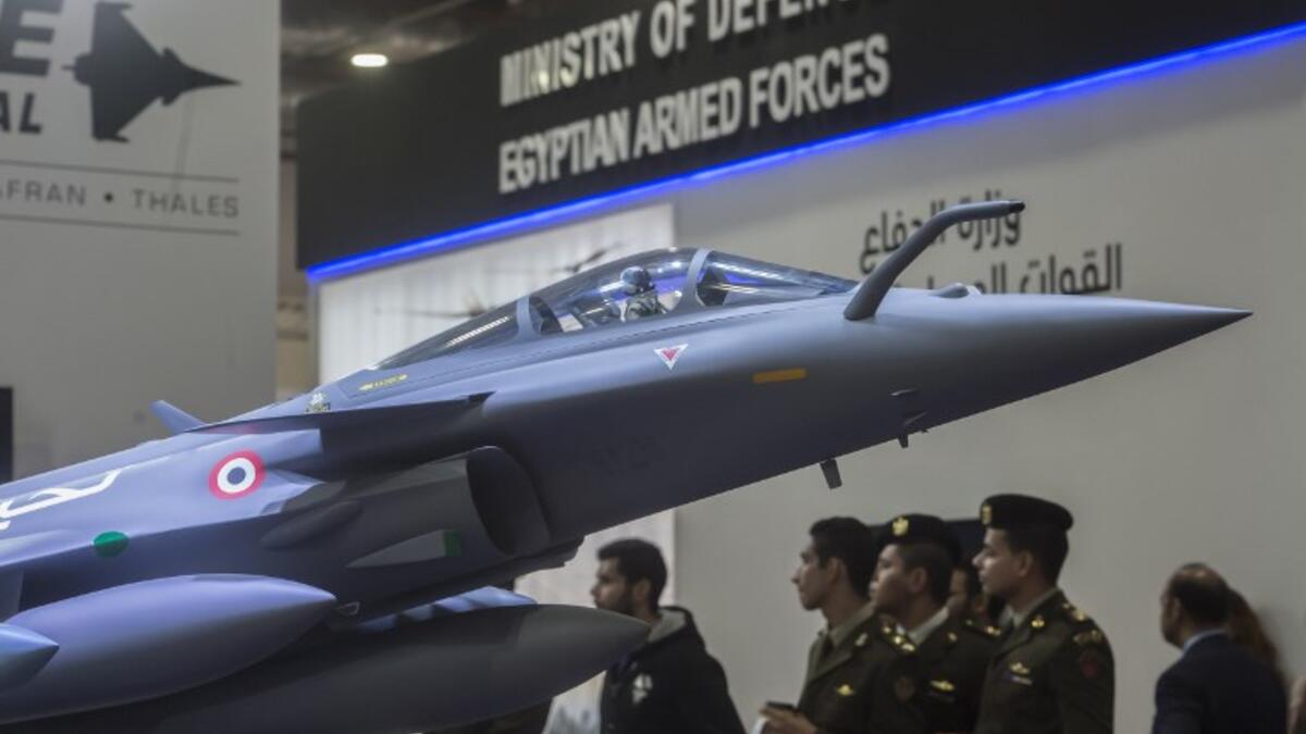 A model of the French made Rafale jet fighter is displayed during Egypt’s first Service Defence Exhibition in Cairo on December 3, 2018, at the International Exhibition Center. 
Khaled DESOUKI / AFP