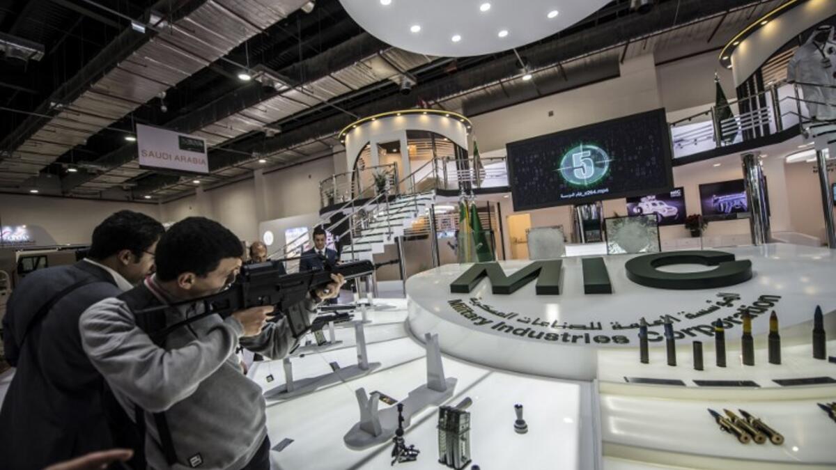 A visitor aims a weapon at the Saudi stand during Egypt’s first Service Defence Exhibition in Cairo on December 3, 2018, at the International Exhibition Center. 
Khaled DESOUKI / AFP