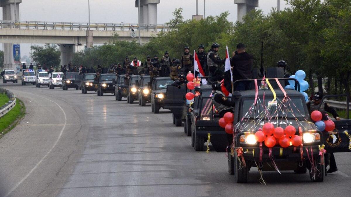Members of the Iraqi security forces parade in the streets of the Iraqi city of Mosul.
Zaid AL-OBEIDI / AFP