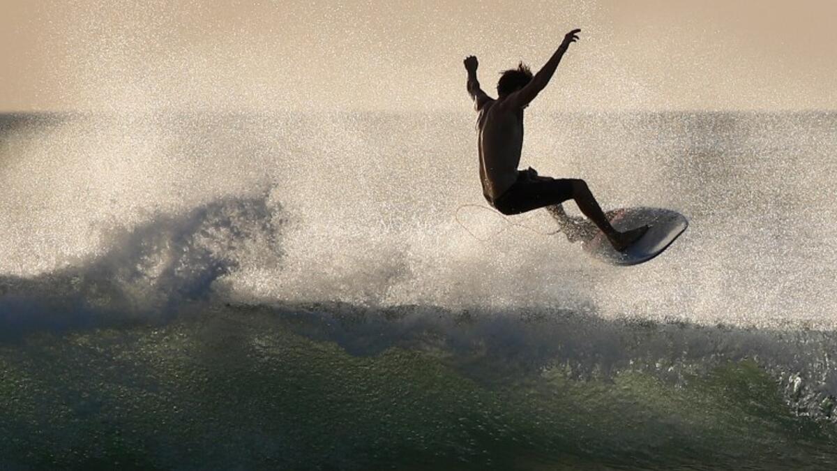 A surfer enjoys the waves at Las Baulas National Marine Park, Playa Grande, Costa Rica on December 10, 2018. David GANNON / AFP