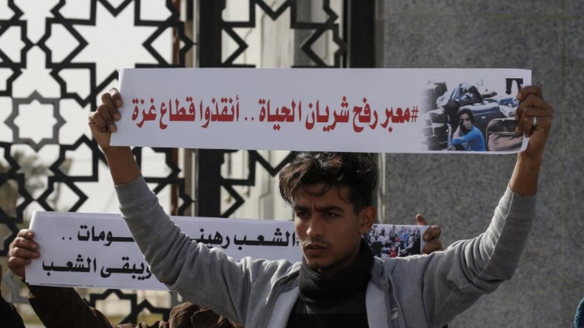 Palestinians protest against the closure of the Rafah crossing point between Egypt and the southern Gaza Strip and the Israeli blockade on the territory, on January 24, 2019 in Rafah. 
SAID KHATIB / AFP