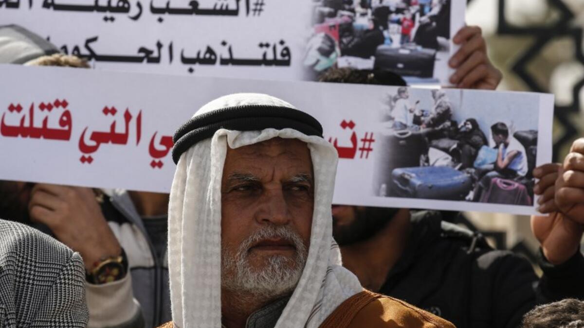 Palestinians protest against the closure of the Rafah crossing point between Egypt and the southern Gaza Strip and the Israeli blockade on the territory, on January 24, 2019 in Rafah. 
SAID KHATIB / AFP