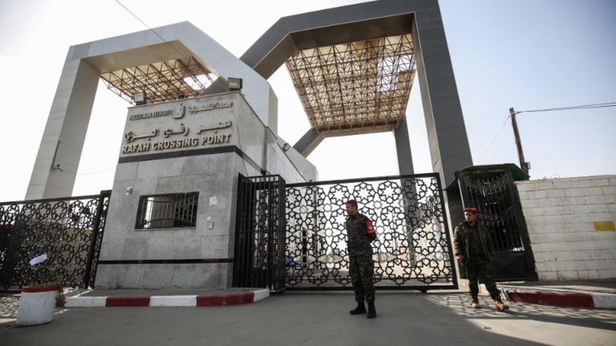Palestinian security forces loyal to Hamas stand at the Rafah crossing point between Egypt and the southern Gaza Strip on January 24, 2019 in Rafah. 
SAID KHATIB / AFP