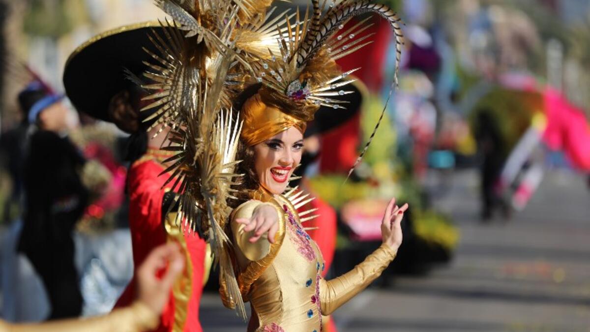 A performer takes part in the Nice Carnival parade on February 16, 2019 in Nice, southeastern France. The 135th carnival runs from February 16 to March 2, 2019, and celebrates this year the "King of Cinema". 
VALERY HACHE / AFP