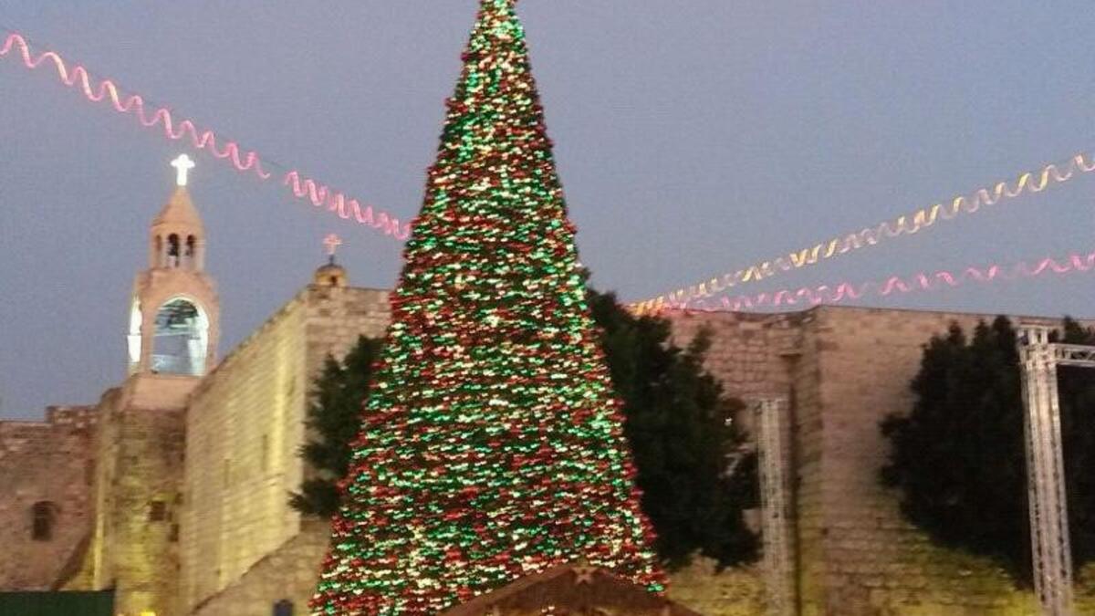 Bethlehem typically puts on a show at Christmas time, with a huge tree in Manger Square, and a Christmas Eve procession. None of this erases the struggles of occupation facing the West Bank town, symbolized by the Her Homa Israeli settlement which looms from the opposite hill, and the partition wall which chokes Aida Camp.