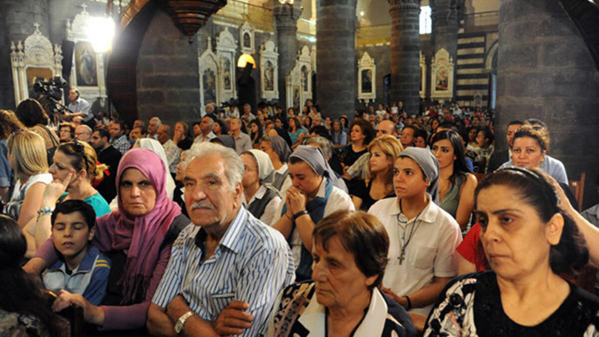 After a group of nuns and orphanage workers were kidnapped and held for a week, Syrian Christians and Muslims attended a prayer vigil for peace at the Lady of Dormition, the Melkite Greek Catholic patriarchal cathedral in the Old City of Damascus, on September 7, 2013.