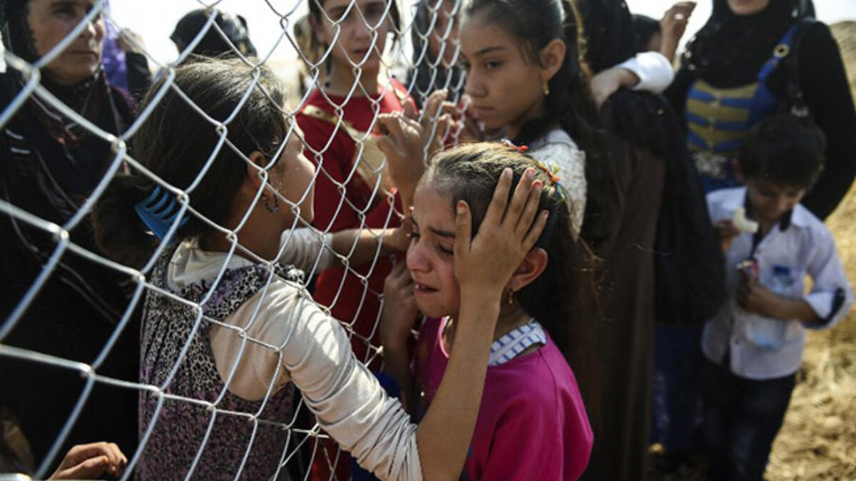 Displaced Iraqi families are reunited after fleeing violence in Mosul.