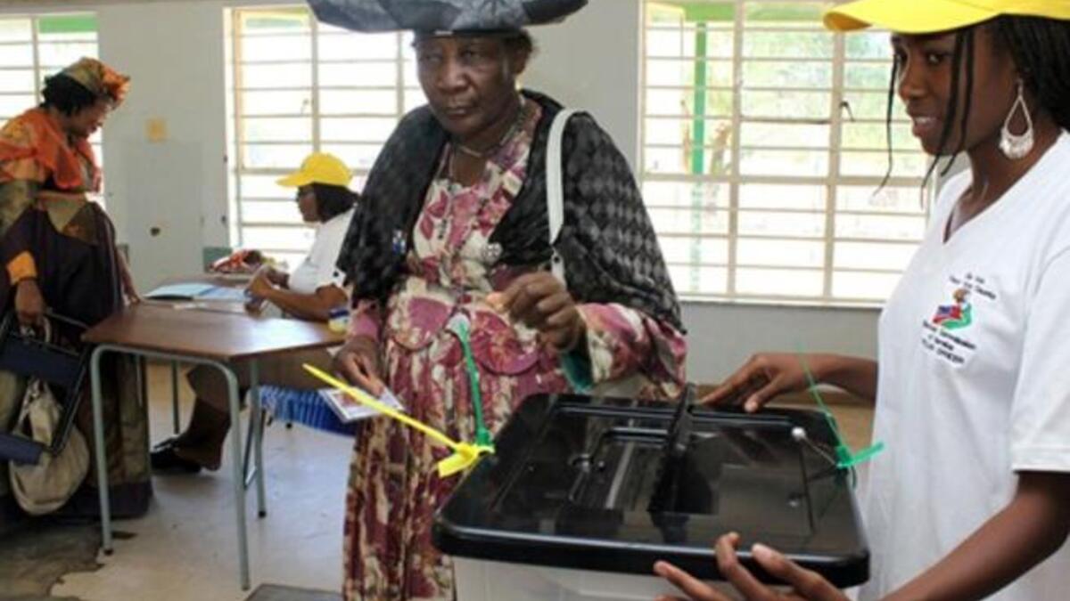 An Oshiherero woman casts her vote at a polling station in Windhoek. About 1.18 million voters are registered to vote for regional councillors in 107 constituencies in 13 political regions. The elections cost about 120 million Namibia dollars (12,457 euros and 16,615 US dollars).