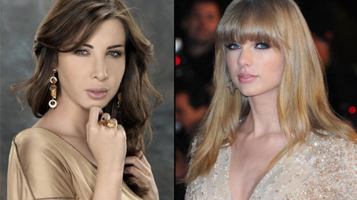 They may not look totally identical, but sweetie pie singer Nancy Ajram has the same home-girl spirit as singer-songwriter Taylor Swift. They emanate innocence, but you know that deep down they’ve got a fighter’s spirit...just listen to Nancy at the Arab Idol judging table, or listen to one of Tay-Tay’s songs about her many boyfriends!